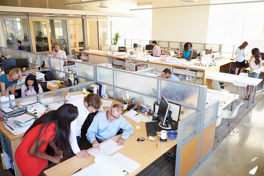 Employee phishing awareness plays a critical role in preventing cyberattacks Interior Of Busy Modern Open Plan Office