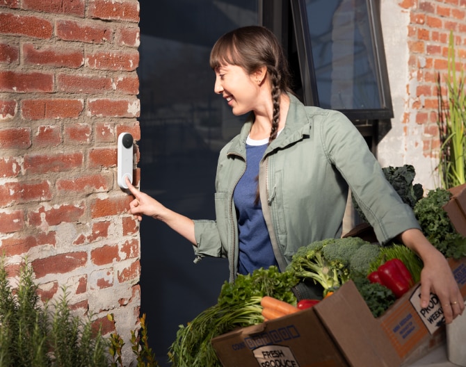 Delivery worker ringing the Google Nest Doorbell to someone's home Delivery worker ringing the Google Nest Doorbell to someone's home