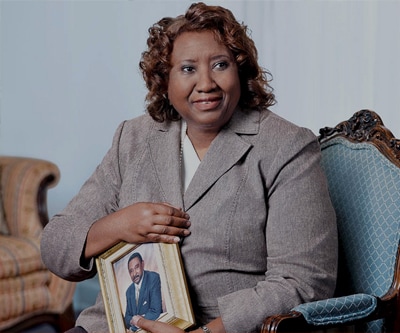 Delores White holds a photo of her late husband Martin. Delores White holds a photo of her late husband Martin.