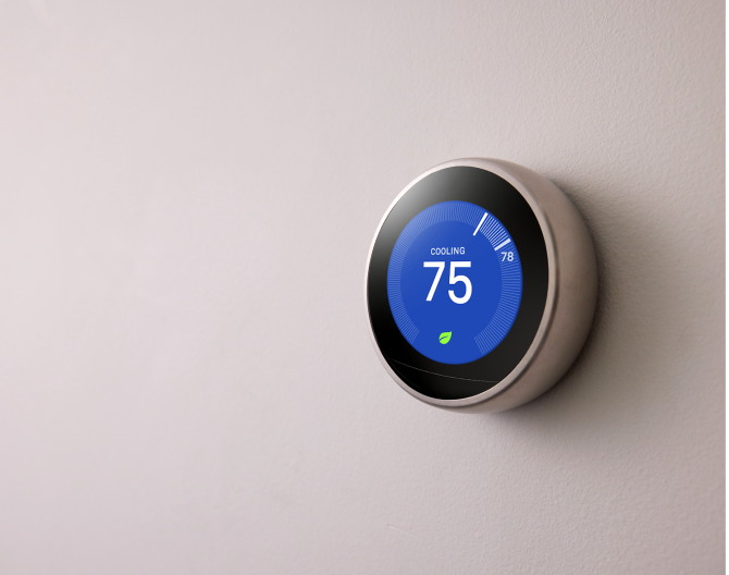 Google Nest Learning Thermostat on a wall Google Nest Learning Thermostat on a wall
