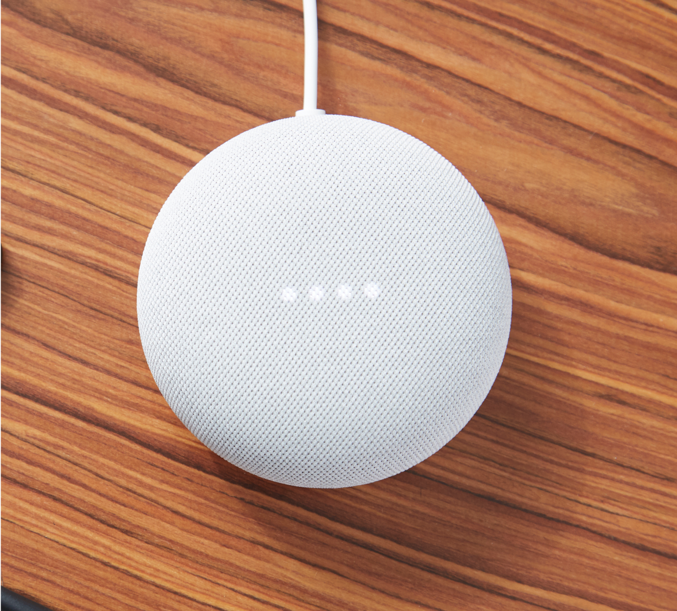 Google Nest Mini (2nd gen) on a wooden table Google Nest Mini (2nd gen) on a wooden table