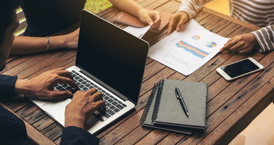 Client data protection requires a multi-pronged program, and a commitment to continuous improvement. Businessman Using Laptop In Business Meeting
